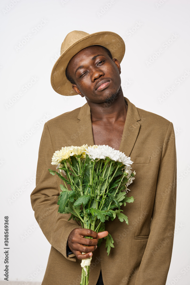 man holding bunch of flowers