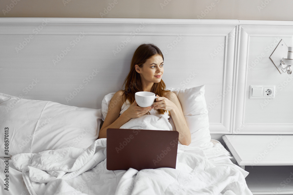 woman sitting on sofa with cup of coffee woman sitting on sofa with cup of coffee
