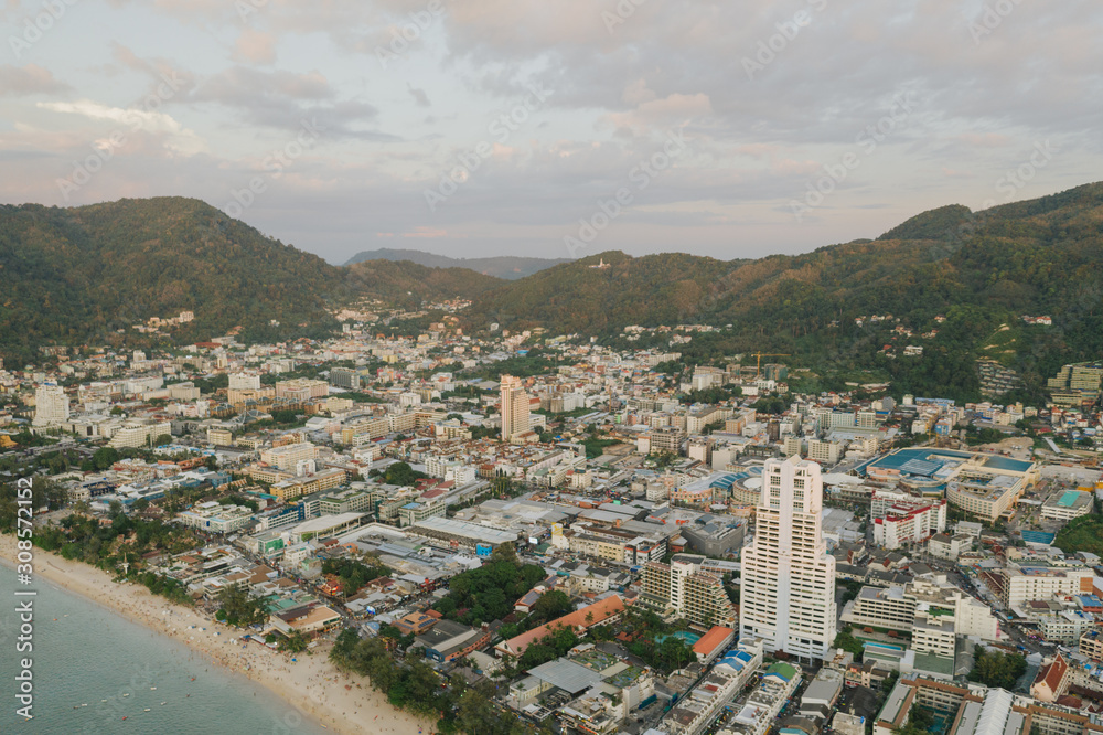 Patong City and Beach life with cars and boats in Thailand Phuket Island Drone flight