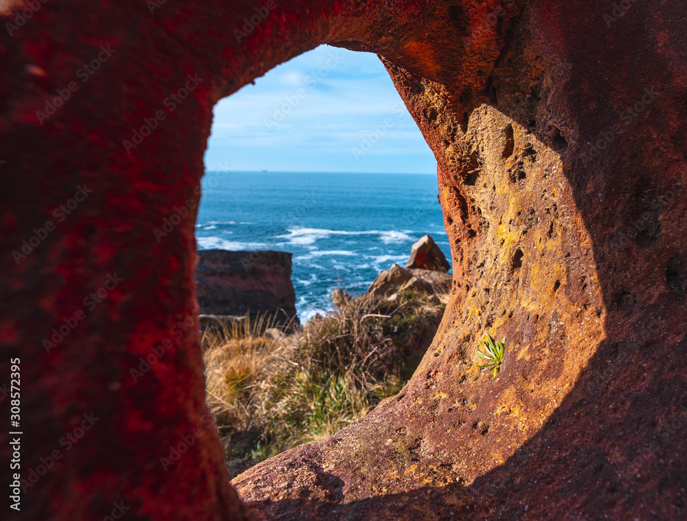A hole in the geoforms of Labetxu on Mount Jaizkibel. Basque Country ...