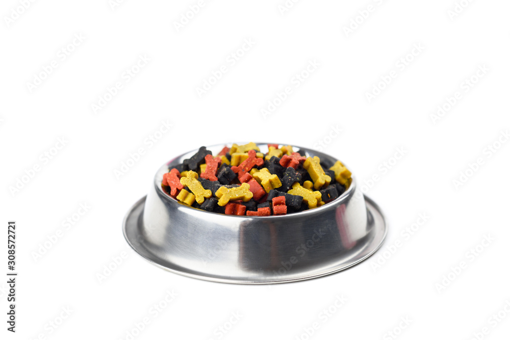 Dry bone shape dog food in metal plate isolated on white background. Dog food choice concept
