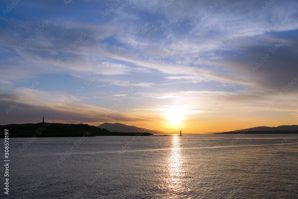 Sunset over Oban Bay and the entrance to Oban harbour. In the background is the island of Kerrera Sunset over Oban Bay and the entrance to Oban harbour. In the background is the island of Kerrera