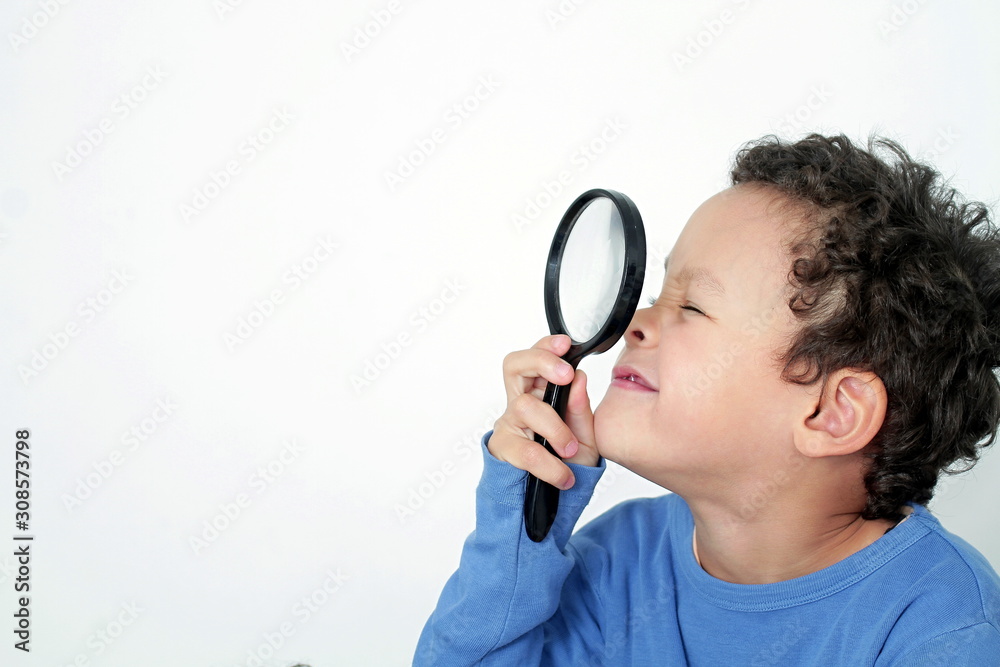 boy with magnifying glass ready to explore on white background stock photo boy with magnifying glass ready to explore on white background stock photo