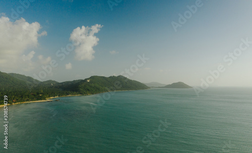 Coastline in Thailand., ocean waves breaking on the rocks, Drone flight
