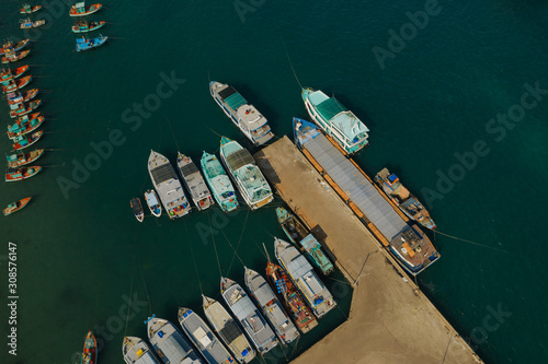 Fishing boats and fisherman houses on the water in Vietnam Phu Quoc Island photo