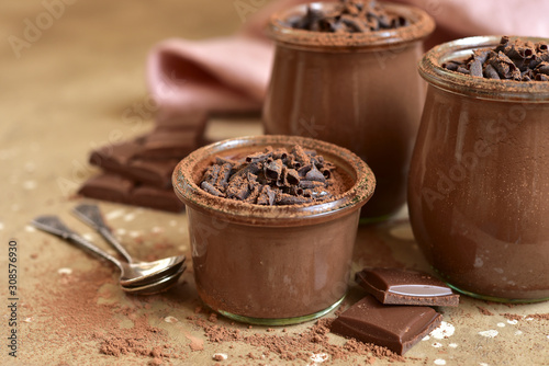 Homemade chocolate pudding in a vintage glass jars. photo