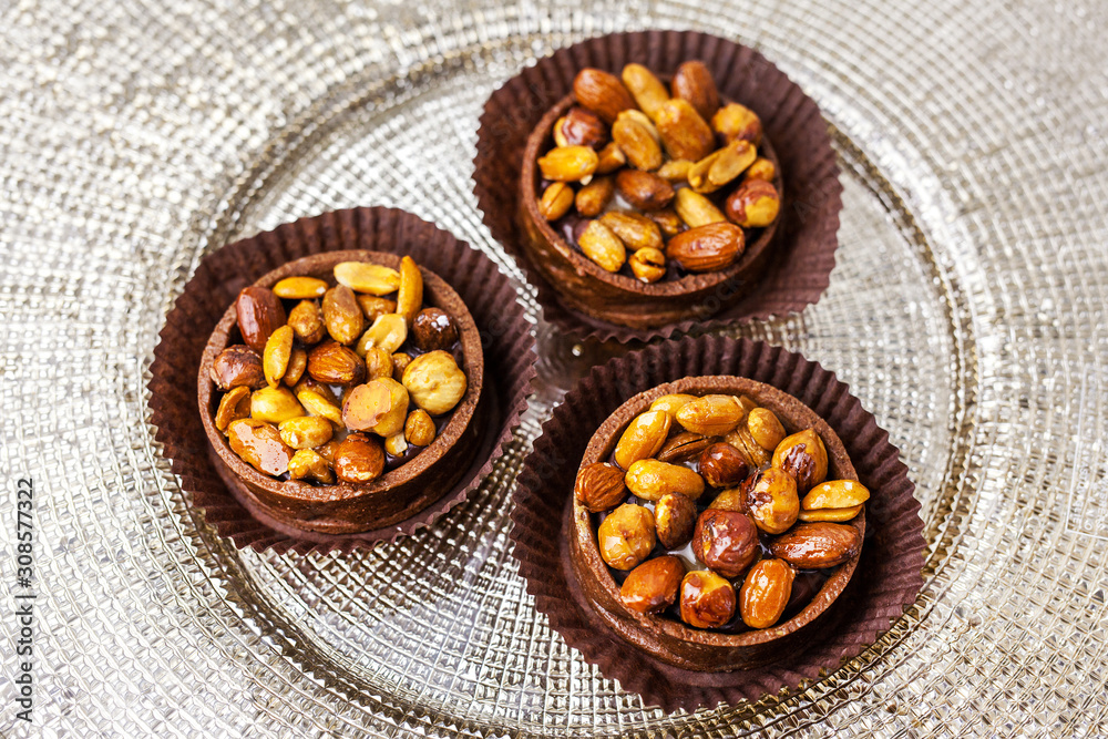 three muffins with chocolate and nuts three muffins with chocolate and nuts