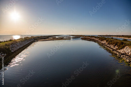 Nature reserve Saline Margherita di Savoia, Apulia, Italy: The salt pan. Salt flats area for sea salt production. A salt marsh, a coastal ecosystem on Adriatic sea.