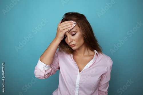 Woman in stress with headache in studio isolated. Migraine concept © burdun