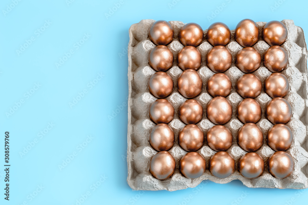 Background with Easter eggs in gold color.