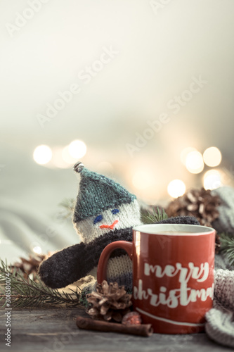 Festive background with a Cup and the inscription merry Christmas. © puhimec