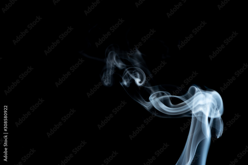 White whispy and wavy smoke abstract on a black background