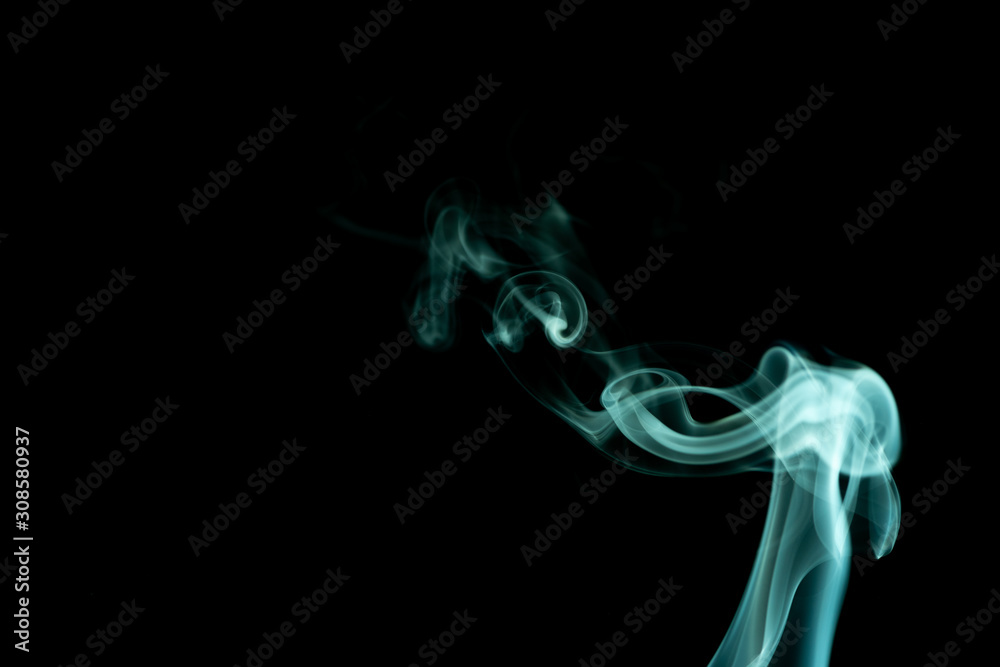 Fototapeta premium Green whispy and wavy smoke abstract on a black background