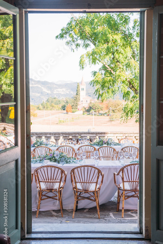 amazing view of a Beautiful wedding table with the tuscany landscape as backdrop, italy
