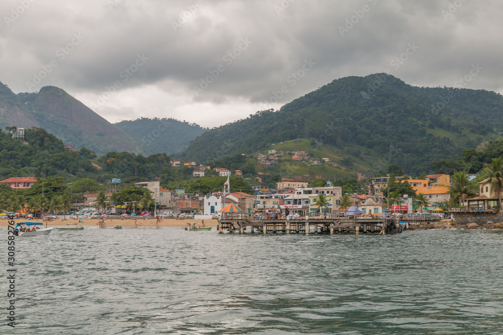 Conceicao de Jacarei city in the hills from the boat, Brazil, South America