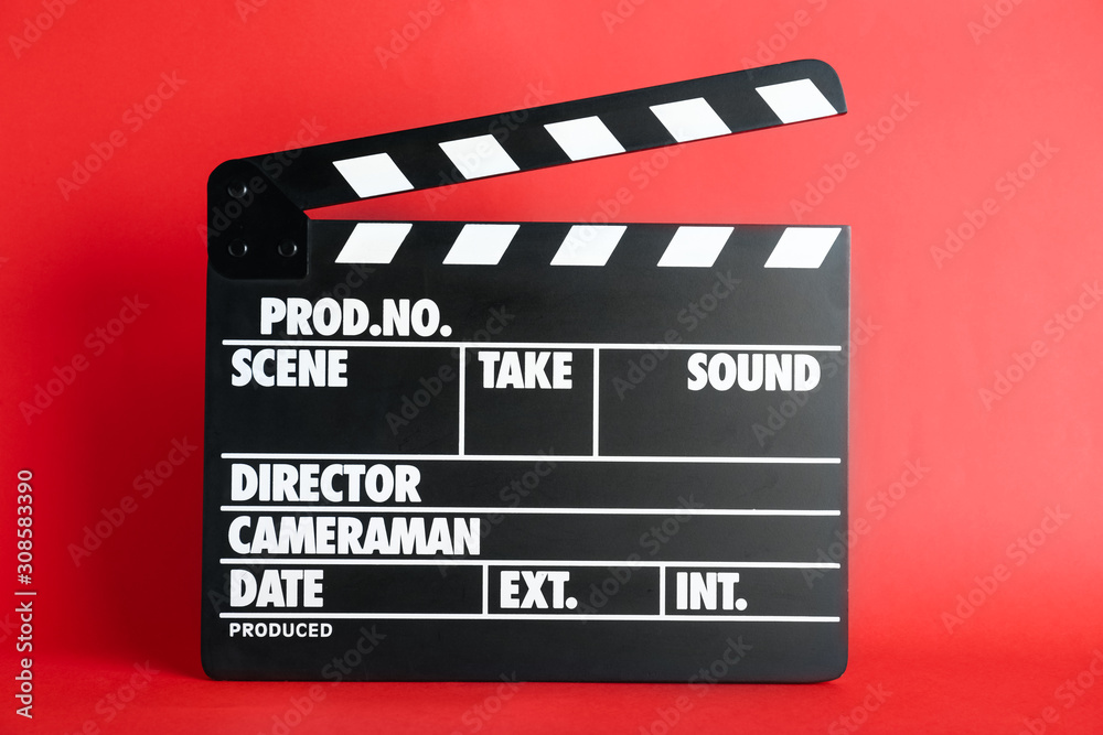 Clapper board on red background. Cinema production
