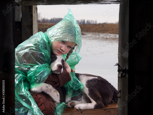 A child and a dog in a flood disaster area