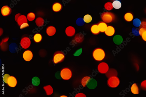 Colorful abstract blurred bokeh on black background