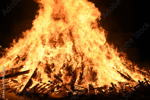 Big Bonfire by Night with Orange Glowing Flames