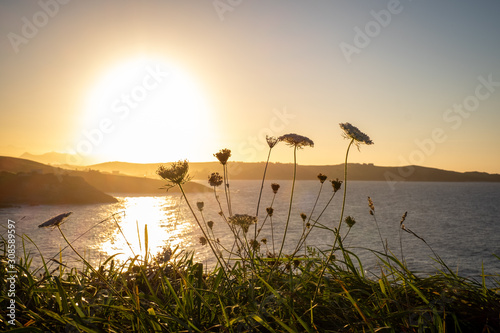 Comillas, Cantabria, northern Spain. Sunset over the ocean.