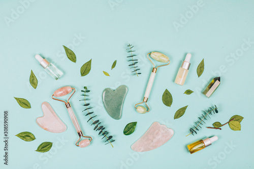 Facial massage kit. Face roller and gua sha massager made from natural stones. photo