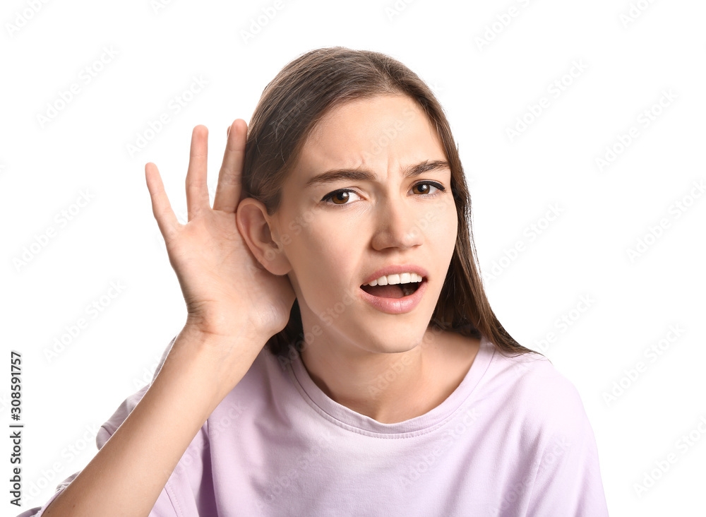 Young woman with hearing problem on white background Young woman with hearing problem on white background