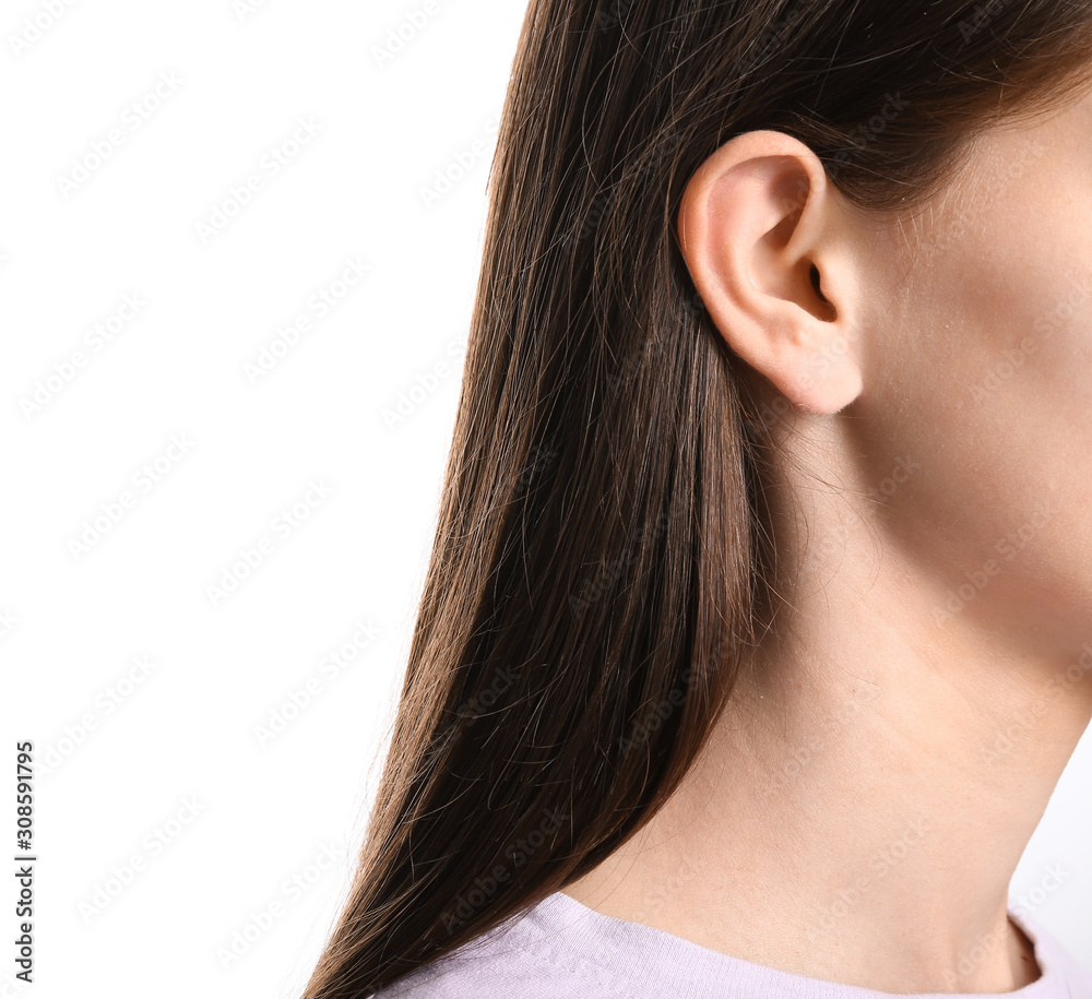 Young woman with hearing problem on white background
