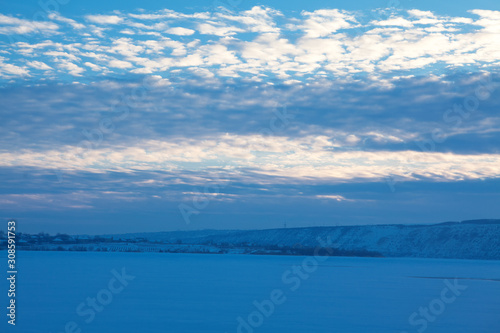 blue winter scenery with low clouds