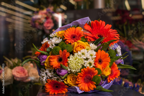 Fototapeta Naklejka Na Ścianę i Meble -  Beautiful Bouquet. Spring flowers in the cold dark room of the flower shop