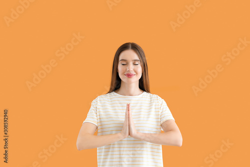 Beautiful woman meditating ...