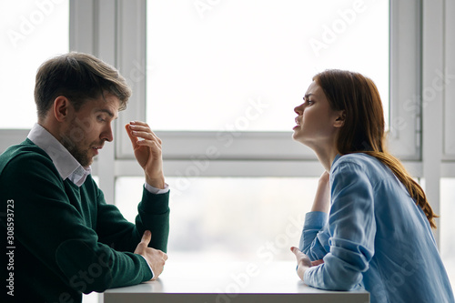 man and woman talking on the phone