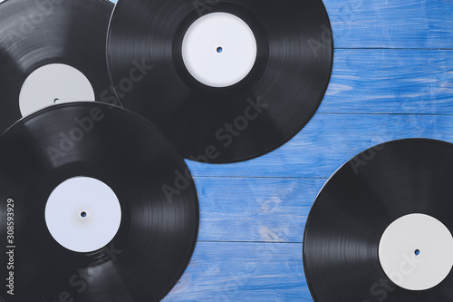 Vinyl disks for record player on color wooden background