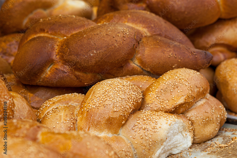 white bread and challah for saturday meal fresh and tasty pastries for the table