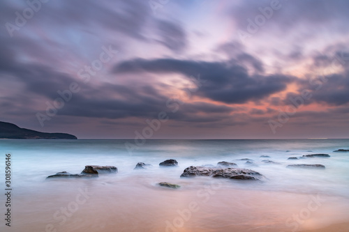 Soft Dawn Seascape with Smoky Haze and Clouds at the Seaside