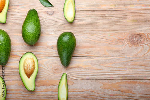 Ripe avocados on wooden background
