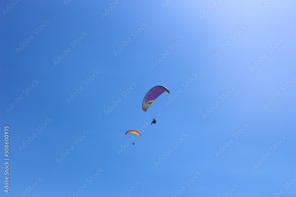 Paragliding in the blue sky on a sunny day. Paragliding in the blue sky on a sunny day.