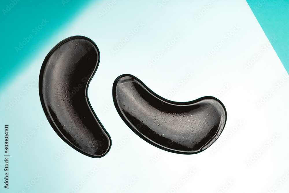 Black eye patches with collagen on bright background Black eye patches with collagen on bright background