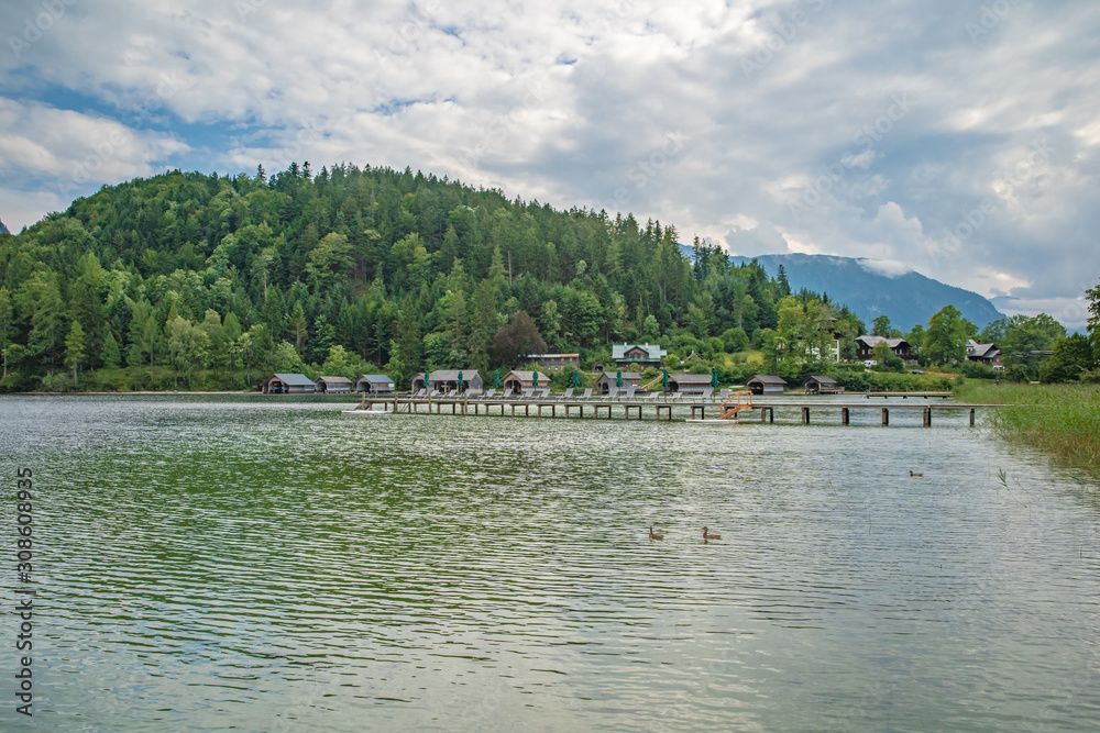 lake in the mountains in austrian alps in beautiful summer tourist season with blue sky and clear water lake in the mountains in austrian alps in beautiful summer tourist season with blue sky and clear water