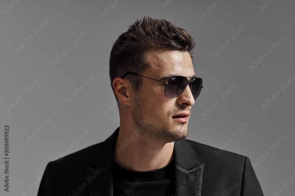 portrait of young man in glasses portrait of young man in glasses