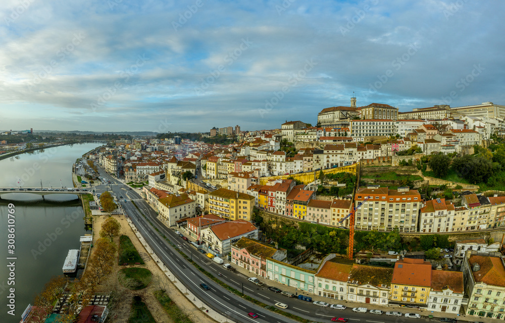 Aerial panoramic sunset view of Coimbra Portugal with the ancient university , Mondego river, Santa Clara, Isabel, pedestrian bridge