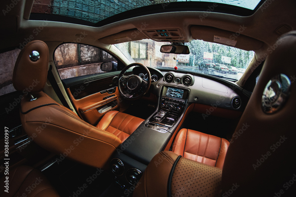 Modern car luxury interior with leather seats and modern electronics
