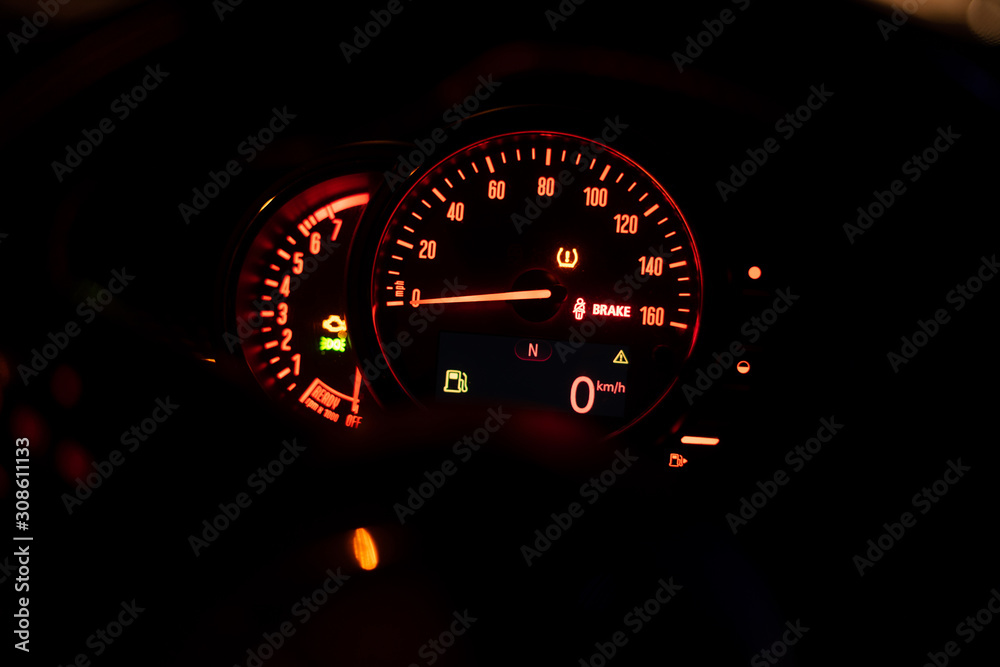 Modern car dashboard with speedometer, rpm meter and indicators
