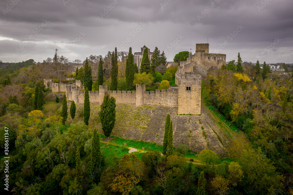 Aerial view of the Templar Castle and Convent of Christ in Tomar Portugal with lush trees and gardens