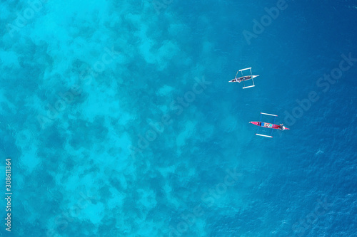 Aerial view traditional fishing group of sea gypsy people in the middle of the blue ocean. © muslian