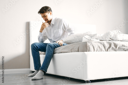 man sitting on sofa with laptop