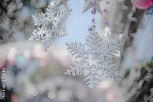 Selective focus Glitter snowflakes decorate in christmas festival.