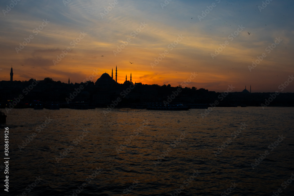 View of Istanbul city and the Golden Horn waterway (Altın Boynuz or Halic) in the evening. Sunset in Istanbul, Turkey