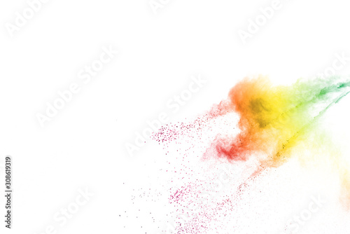 Freeze motion of colorful color powder exploding on white background. Paint Holi.