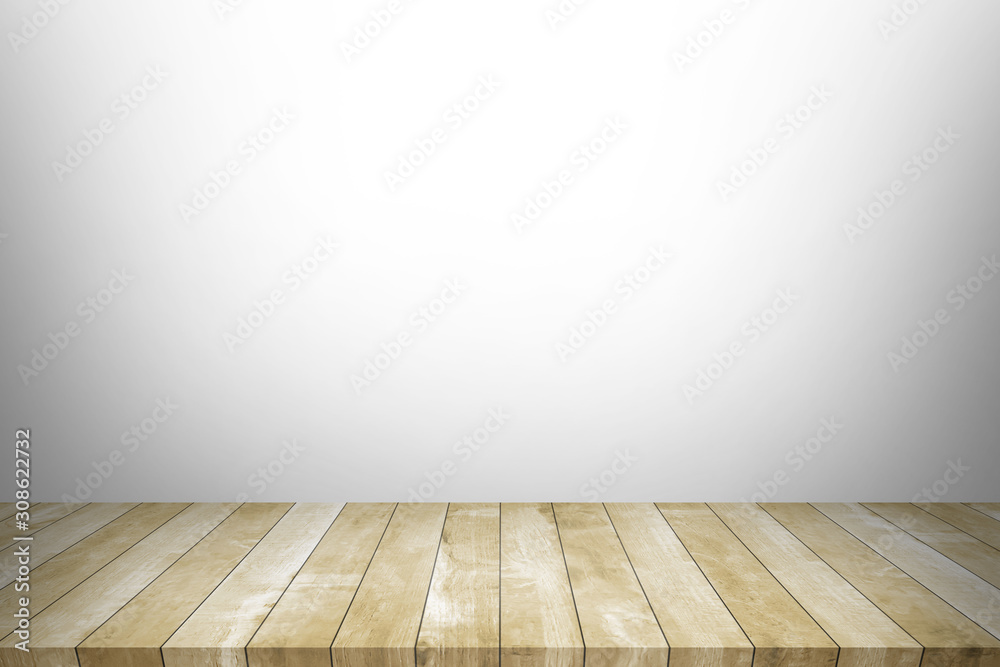 Wood table top with concrete wall background. Used for product placement or montage.	