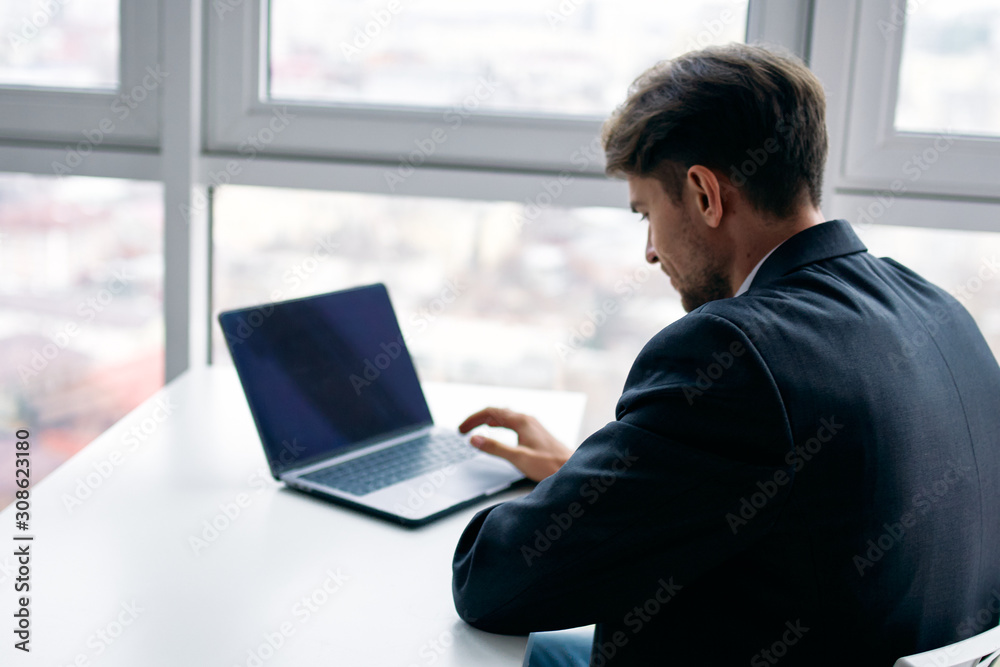 businessman working on laptop in office businessman working on laptop in office